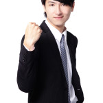 Excited business man showing his fist